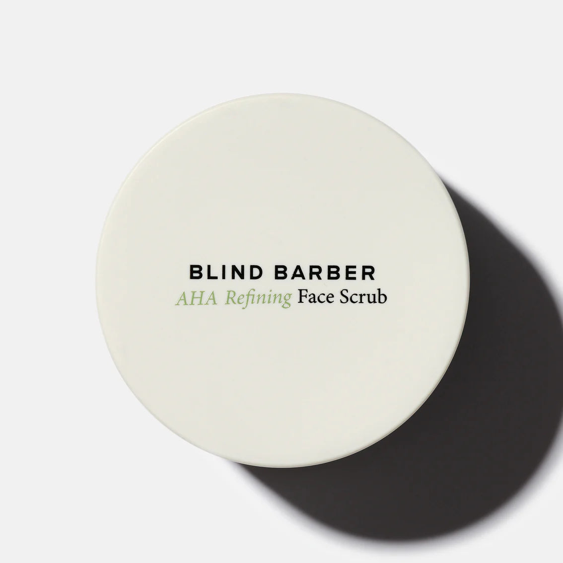 Round container of Blind Barber AHA Refining Face Scrub on a white background