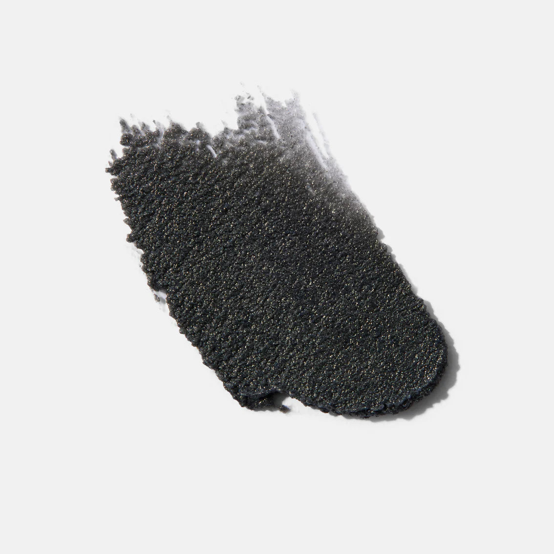 Black textured sponge on a white background