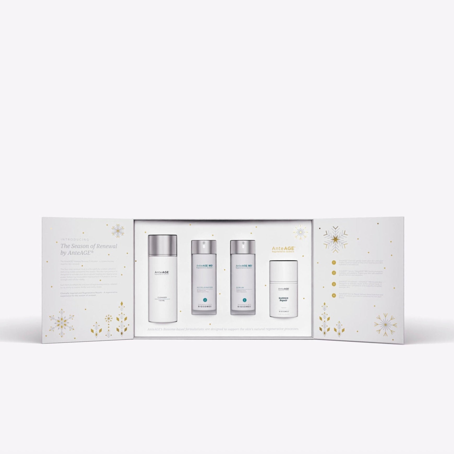 Skincare product set with four bottles in a decorative box on a white background