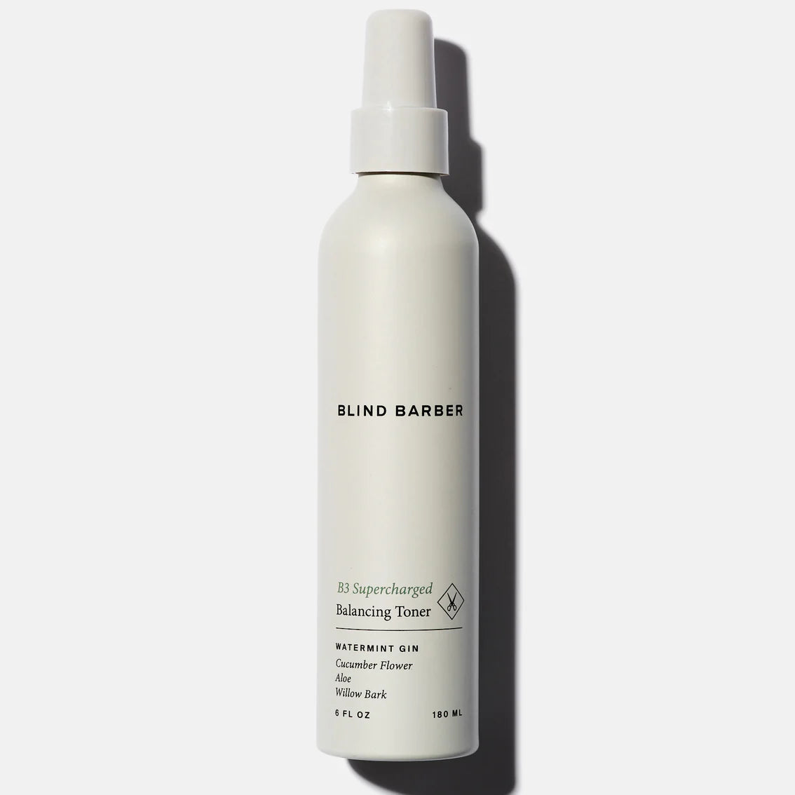 White bottle of Blind Barber toner on a white background
