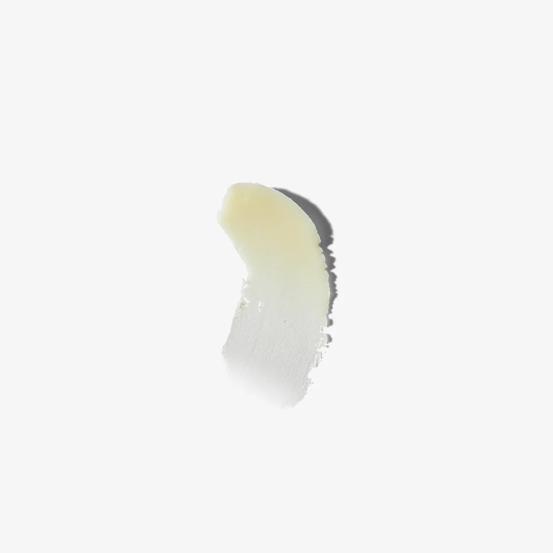 Close-up of a white and yellow cosmetic product on a white background