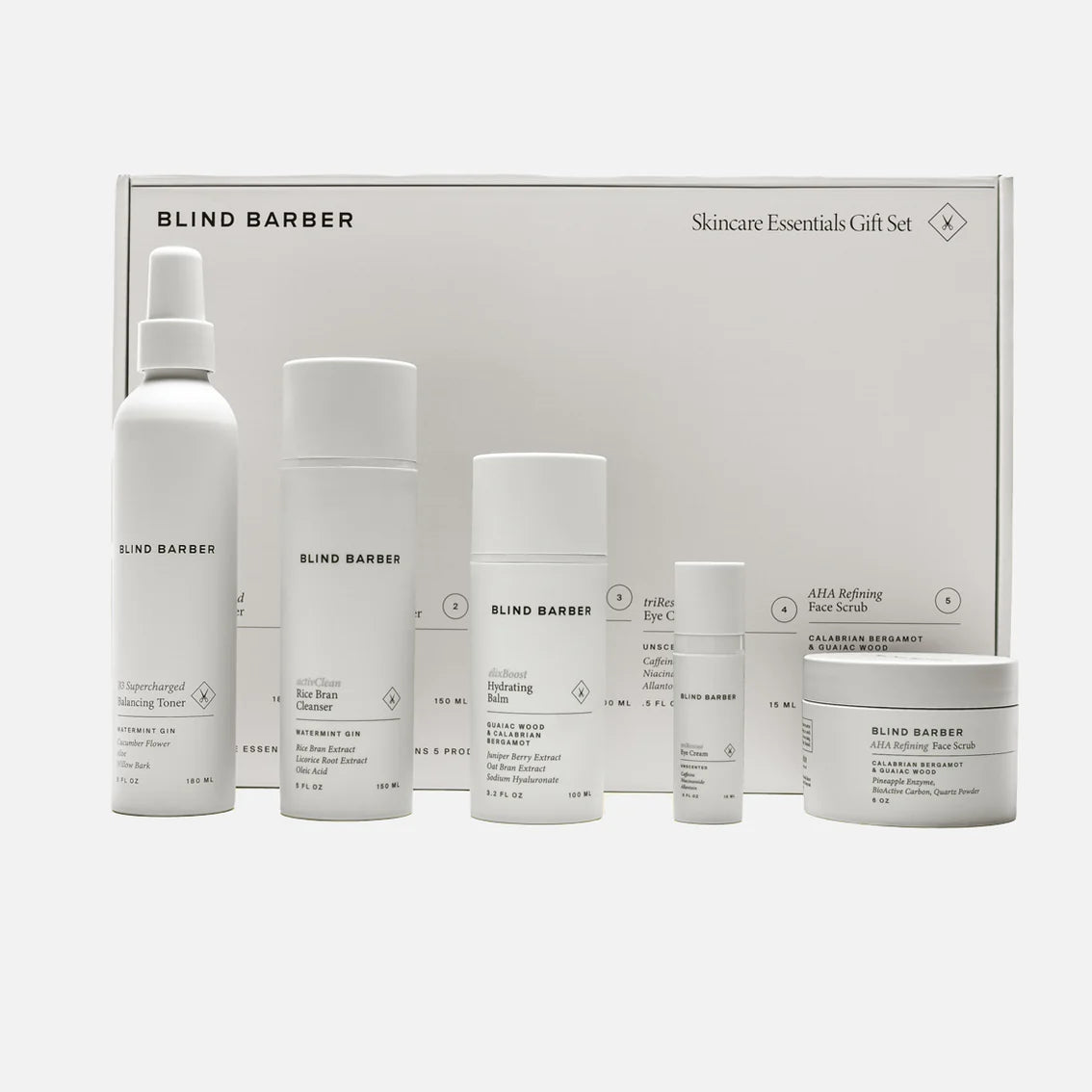 Blind Barber skincare products including bottles and a jar in front of a branded box on a white background.