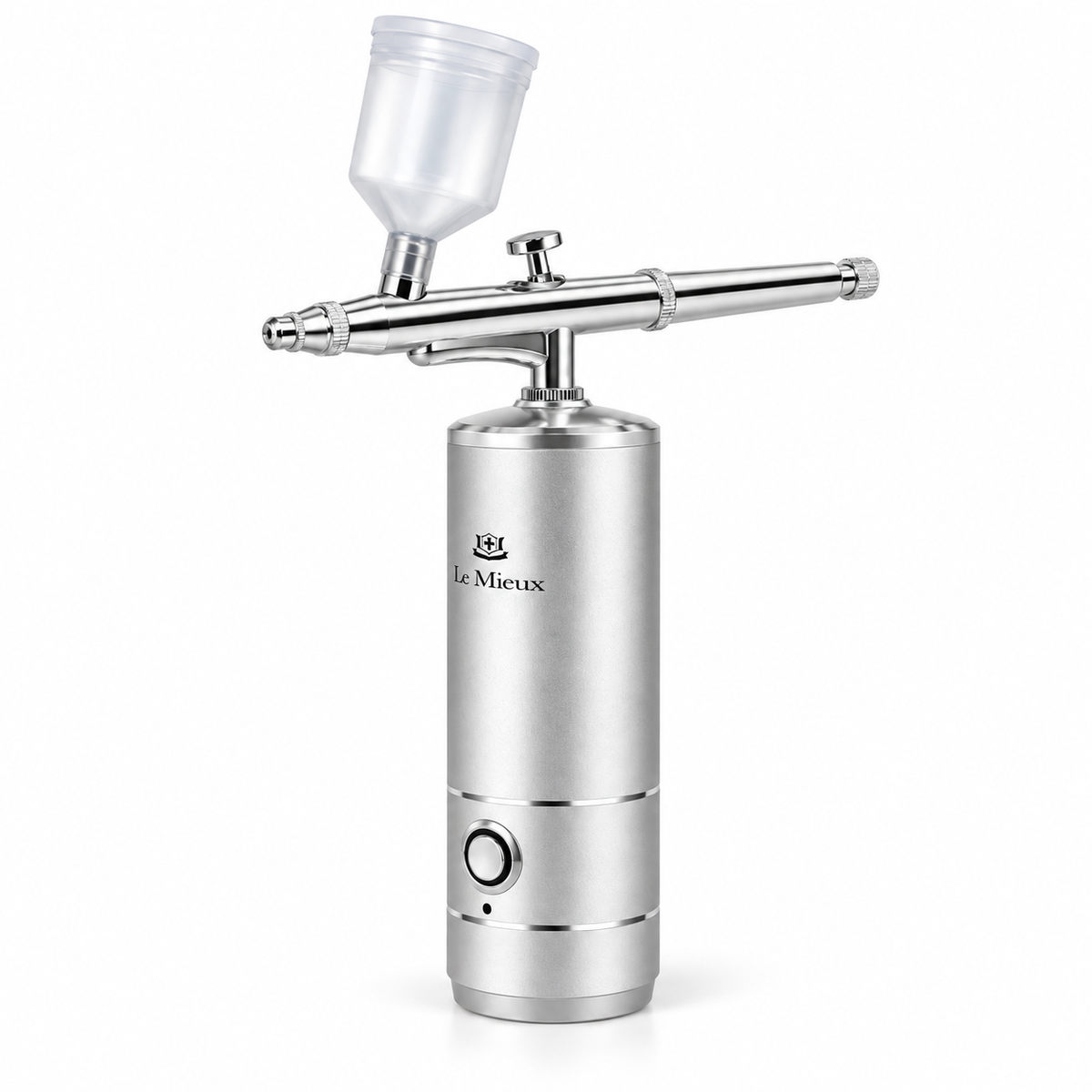 A silver airbrush spray gun with a clear plastic paint cup, shown on a clean white background. The brand name 'Le Mieux' is printed on the metallic body.