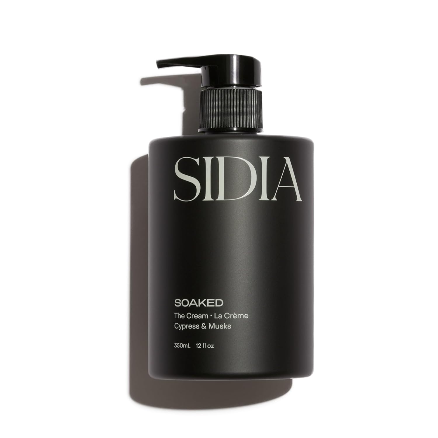 Black bottle of SIDIA 'Soaked' with pump on a white background