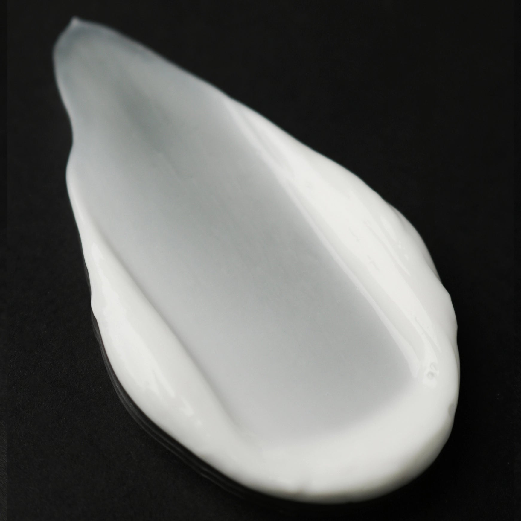 Cream on a black background
