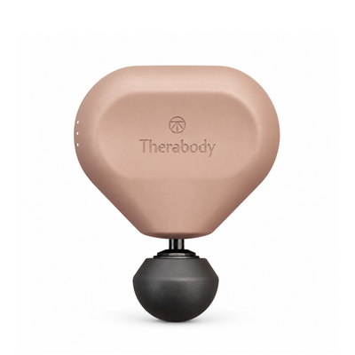 A Therabody massage gun in a matte dusty rose color with a black spherical head, shown against a plain white background.