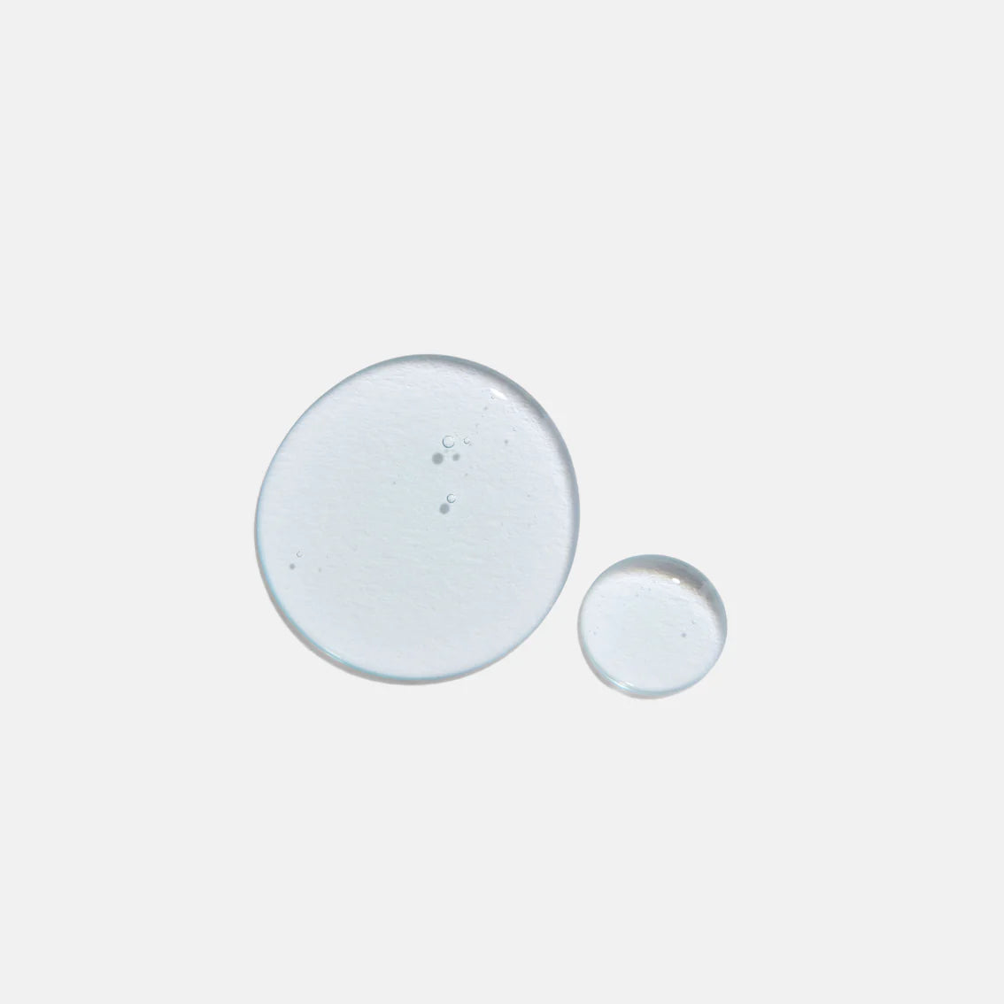 Two small round objects on a light gray background