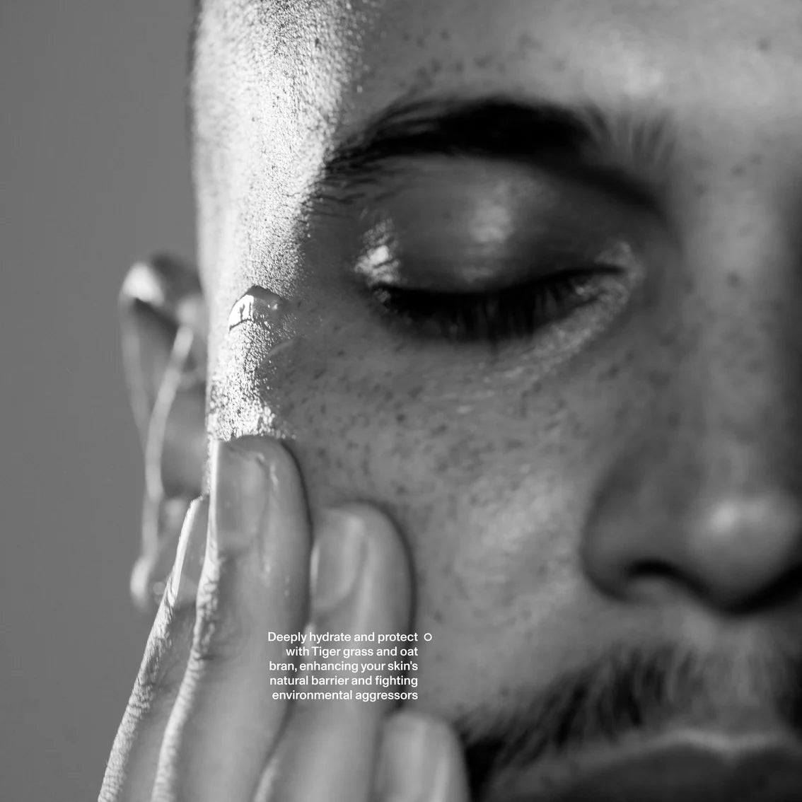 Close-up of a person's face with text overlay on a gray background