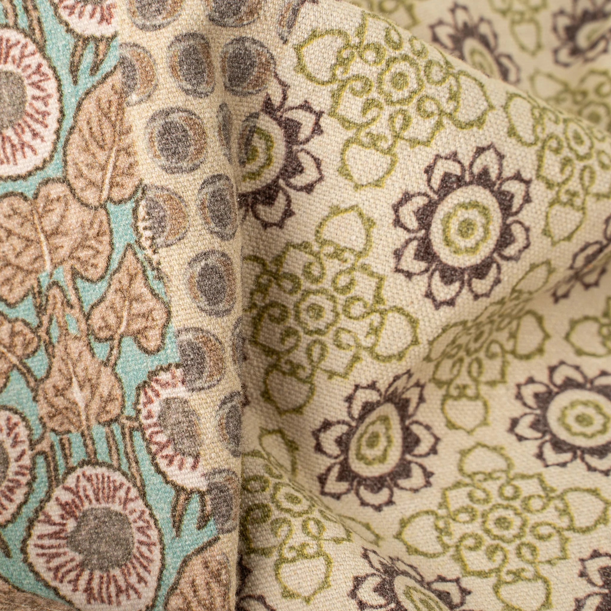 Close-up of two different floral patterned fabrics.