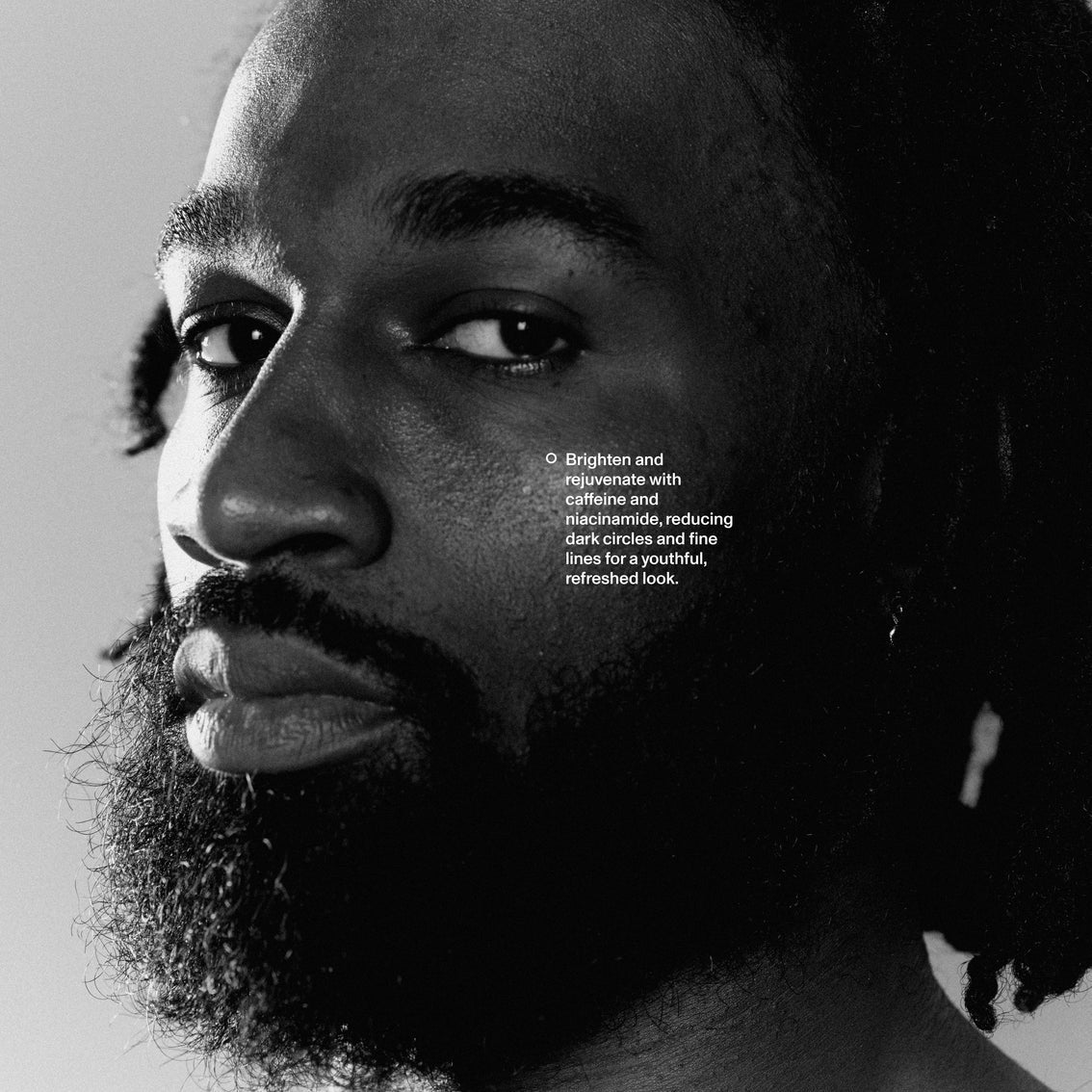 Black and white portrait of a man with text overlay on a light gray background