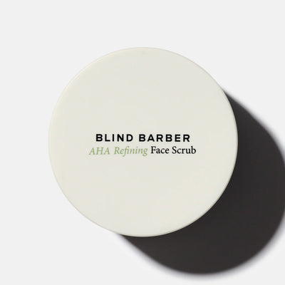 Round container of Blind Barber AHA Refining Face Scrub on a white background