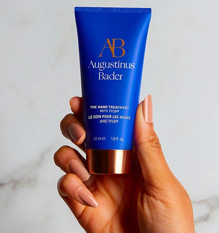 Applying Augustinus Bader The Hand Treatment to dry hands