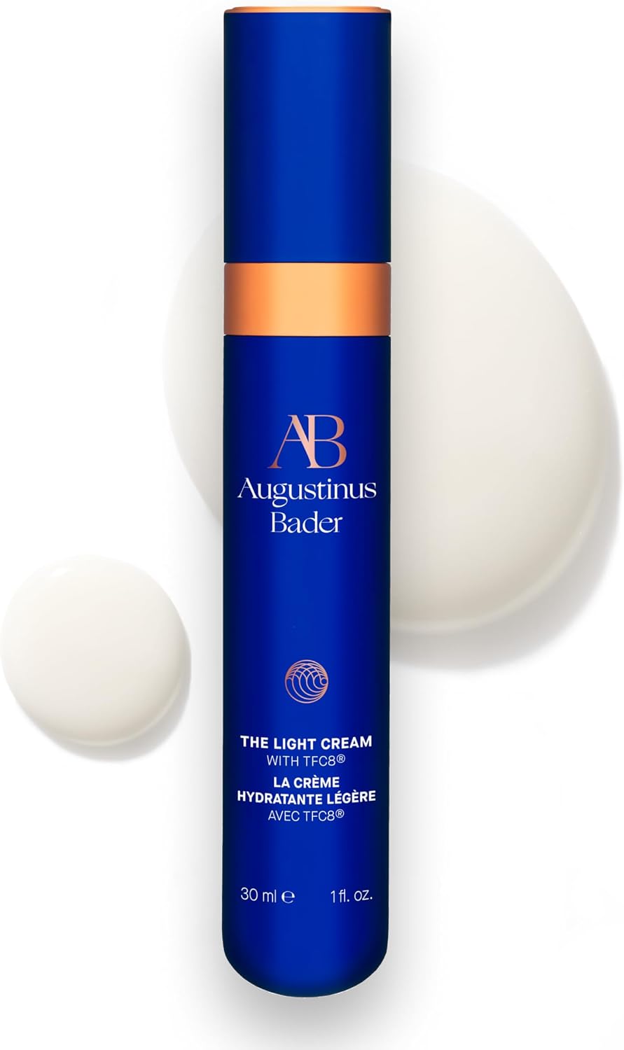 Augustinus Bader light cream bottle with applicator on a white background