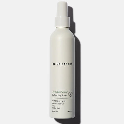 White bottle of Blind Barber toner on a white background