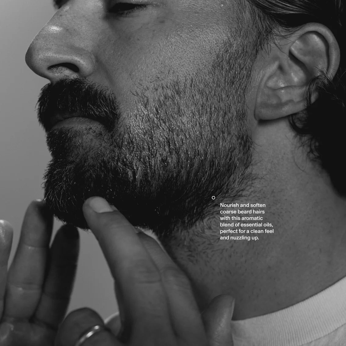 Close-up of a man's face with a focus on his beard, with text overlay.