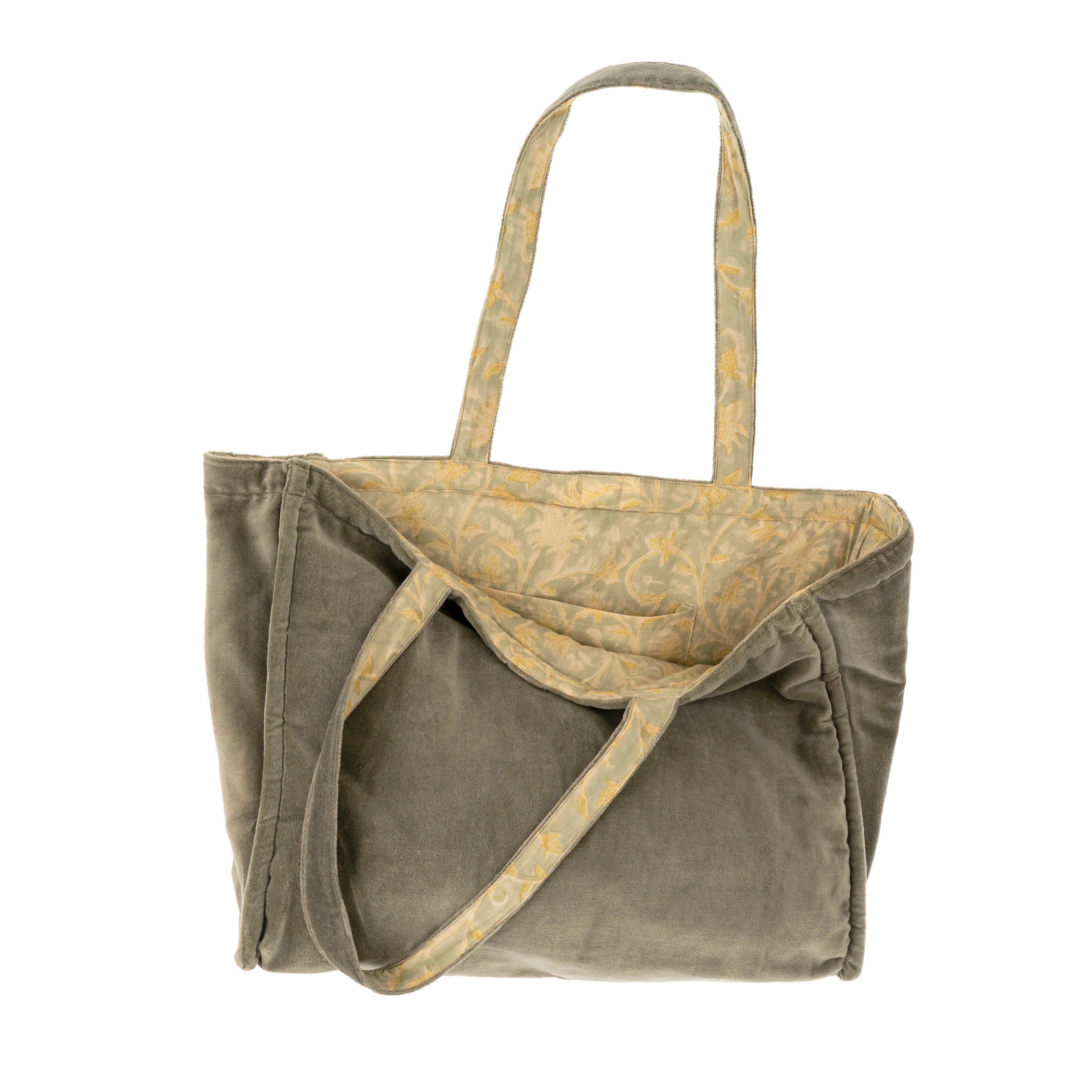 Two bags, one green and one beige with a pattern, on a white background.