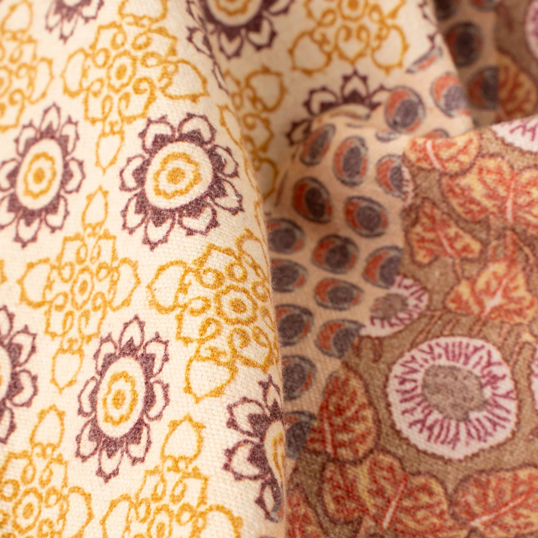 Close-up of two different floral patterned fabrics.