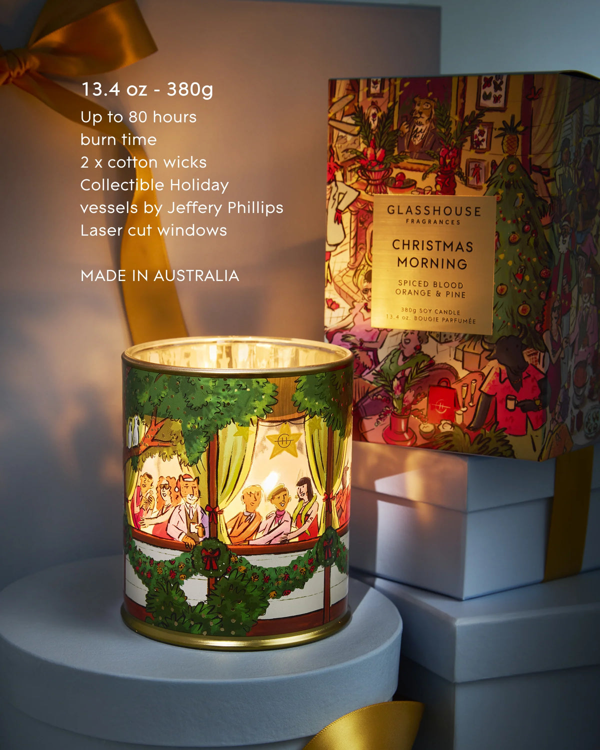 Glasshouse Christmas Morning 380 g candle beside its festive gift box.