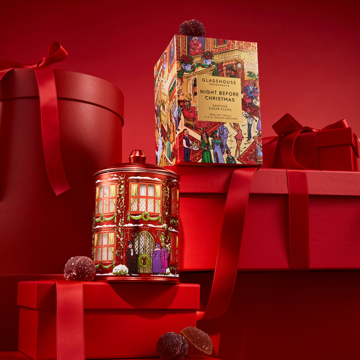 Glasshouse Night Before Christmas 380 g candle beside its festive gift box.