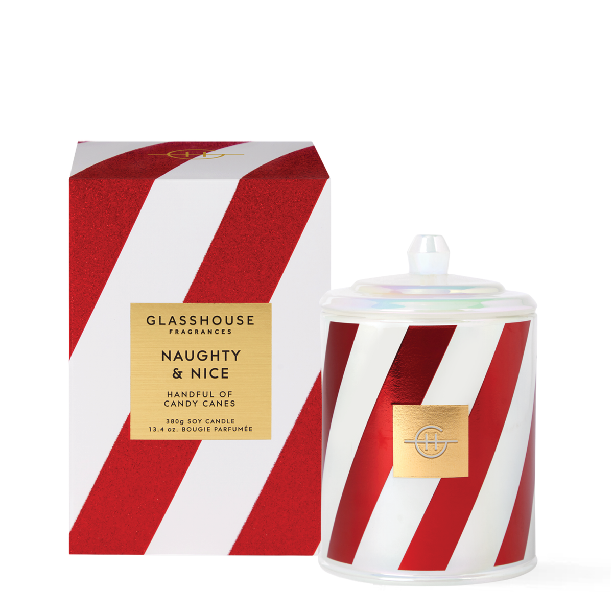 Glasshouse Fragrances Naughty & Nice candle beside its matching glittery holiday gift box