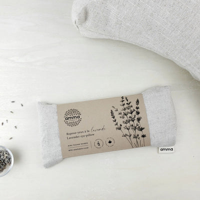 Gray lavender eye pillow with packaging on a white background