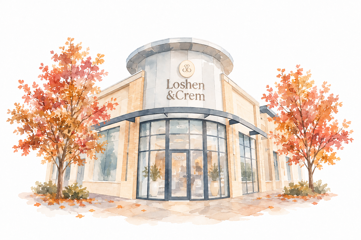 Olive tree, stone counter and curved shelves inside Loshen & Crem’s Edmonton boutique.