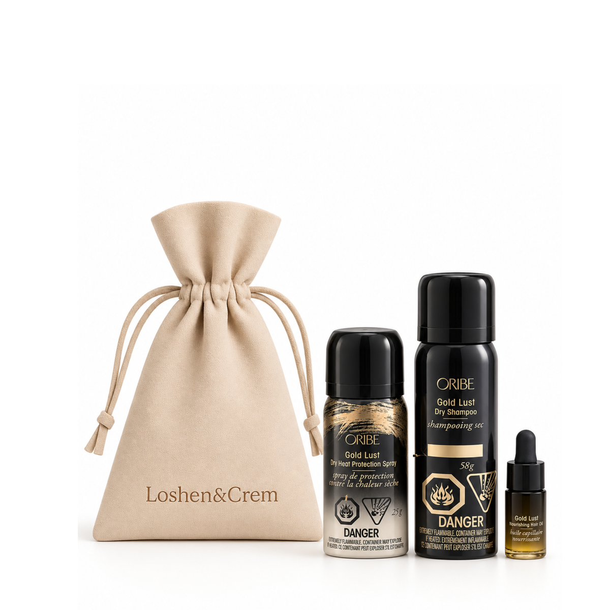 ORIBE Gold Lust dry shampoo, heat protection spray and hair oil beside a beige Loshen & Crem La Pochette drawstring pouch.