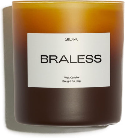 Candle with a label reading 'BRALESS' by Sidia on a white background