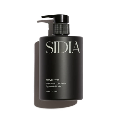 Black bottle of SIDIA 'Soaked' with pump on a white background