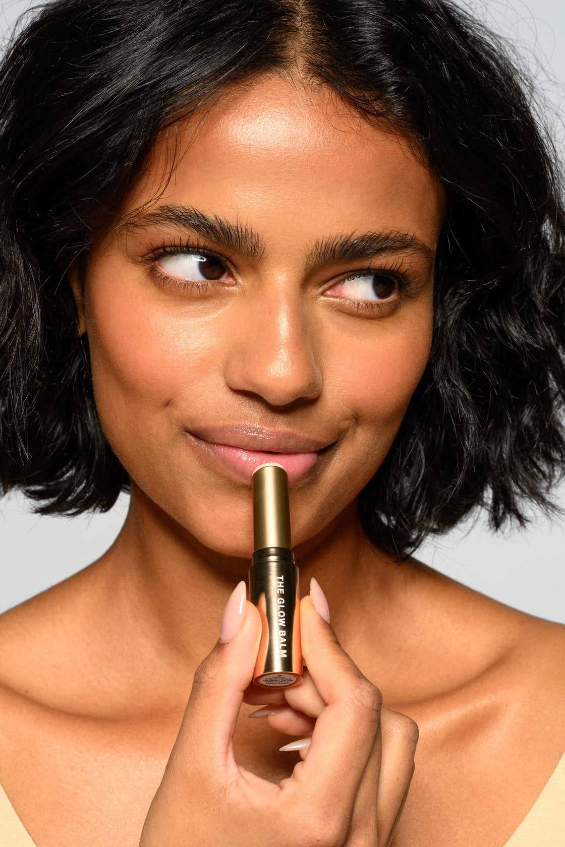 Sara Happ The Glow Balm applied to lips for a juicy, glossy glow