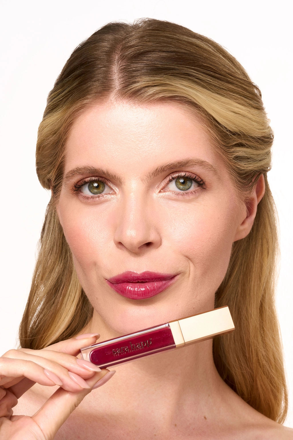 Sara Happ The Wild Berry Slip applied to lips for a glossy berry finish