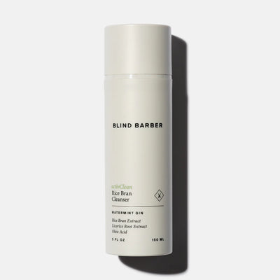 White bottle of Blind Barber hair cleanser on a white background
