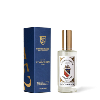 Caswell-Massey Woodgrain Sandalwood Cologne, 88 ml bottle beside its navy blue box