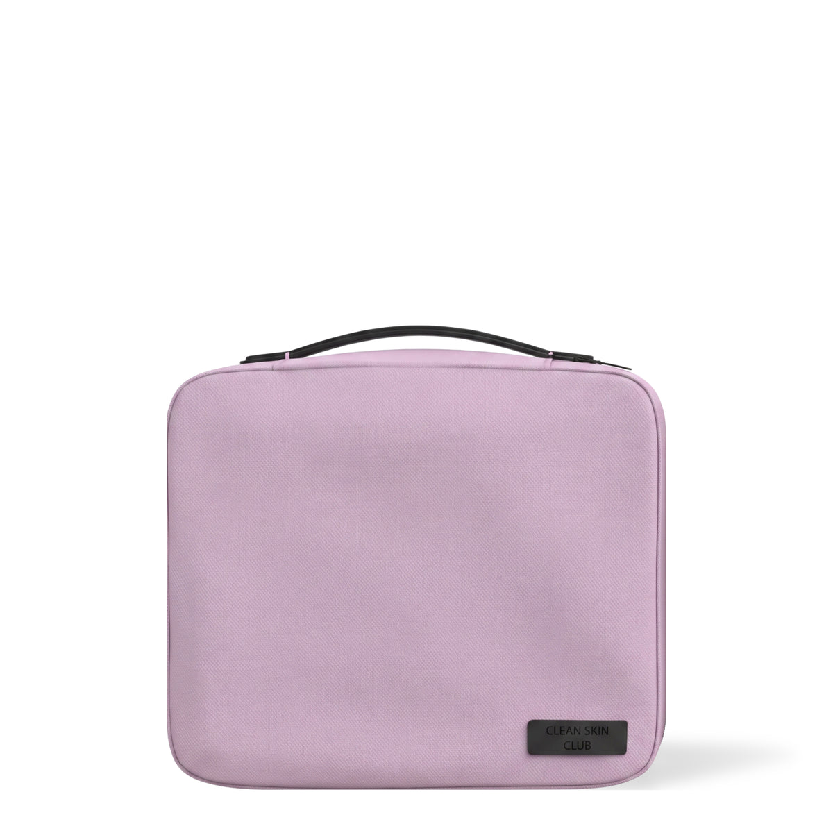 Trousse de voyage The Bag Clean Skin Club, lilas, avec poignée noire, sur fond blanc