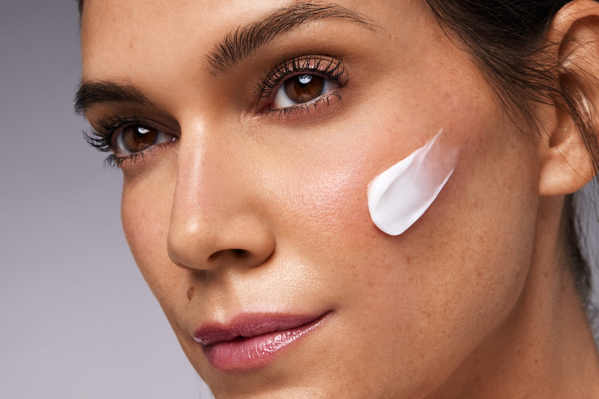 CÉLTHERA cream texture shown on the cheek in Hydrinity's application photograph