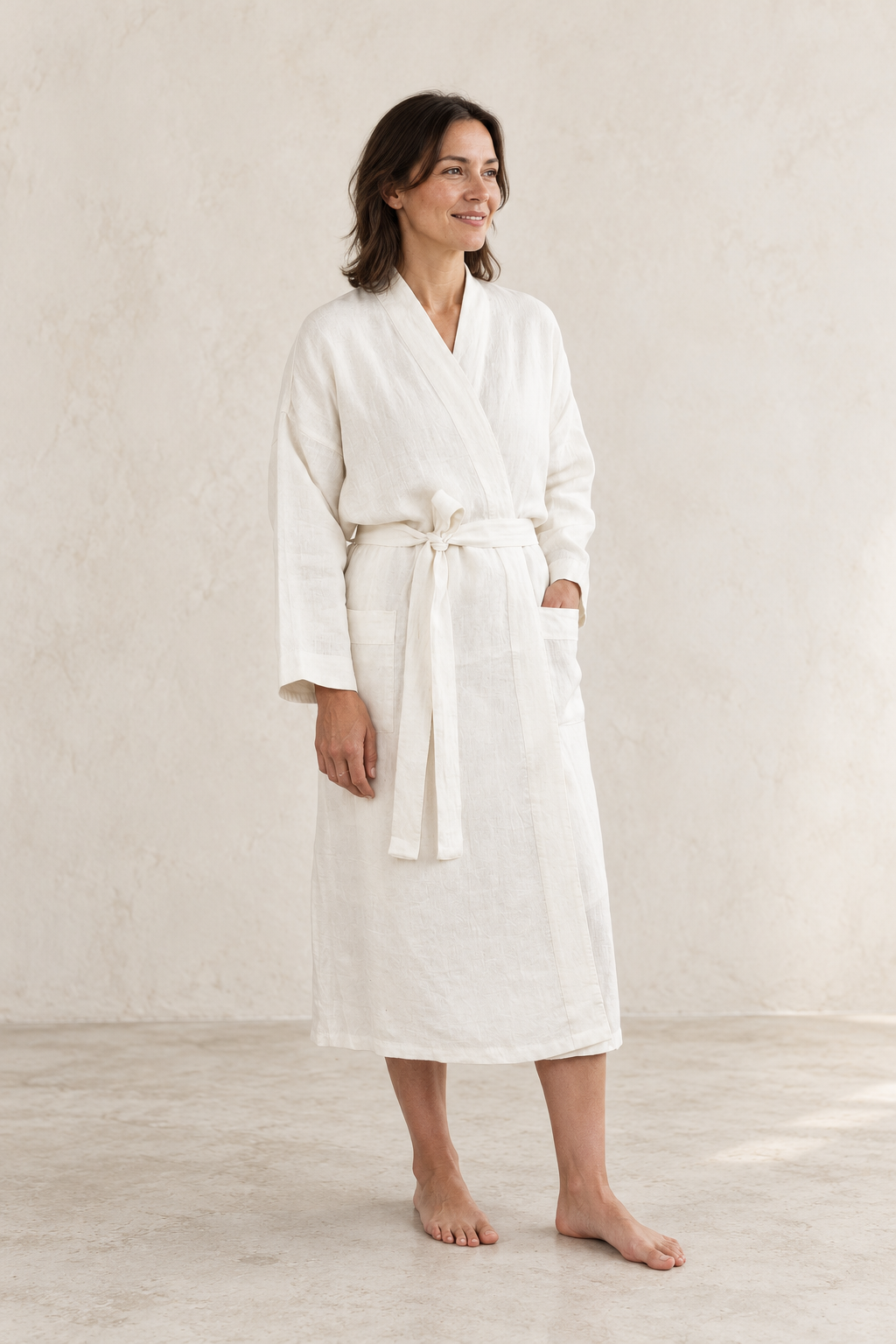 AI-created editorial image of a woman wearing an ivory linen robe.