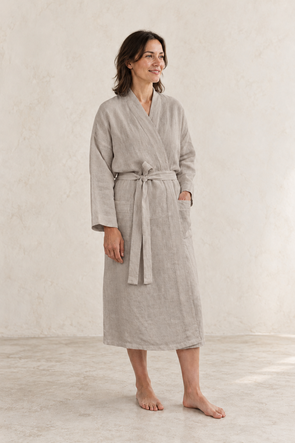 AI-created editorial of a woman wearing a natural flax-coloured linen robe.