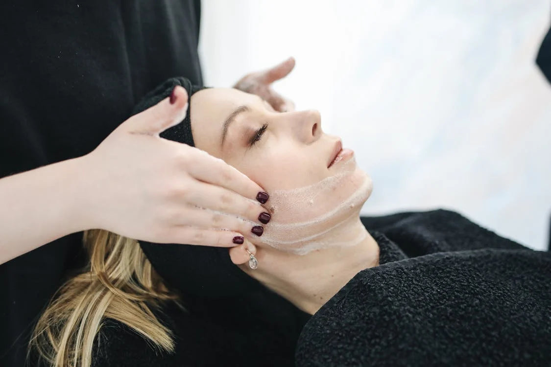 woman receiving facial treatment